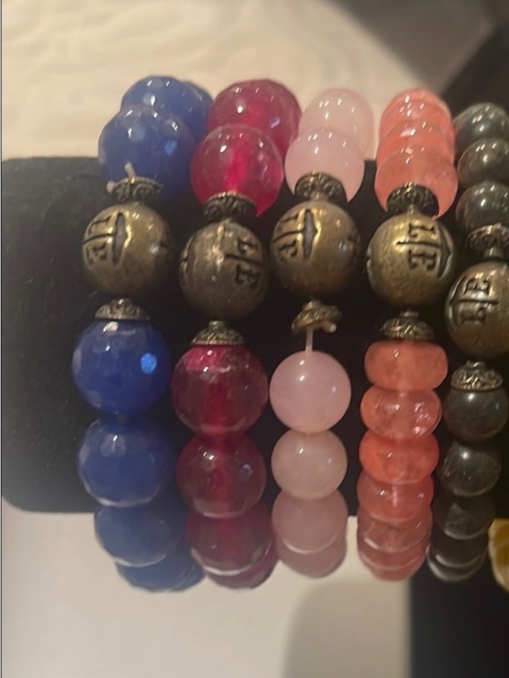 Blue and Red Beaded Bracelets with Glossy Finish and Metallic Accents